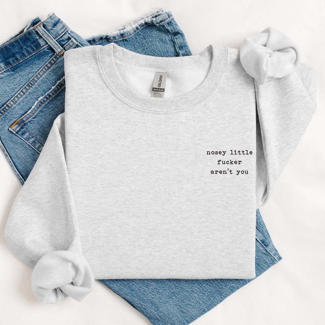 White t-shirt with printed text on a white background