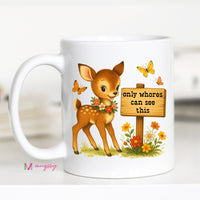 White mug with a cartoon deer and sign graphic on a white background