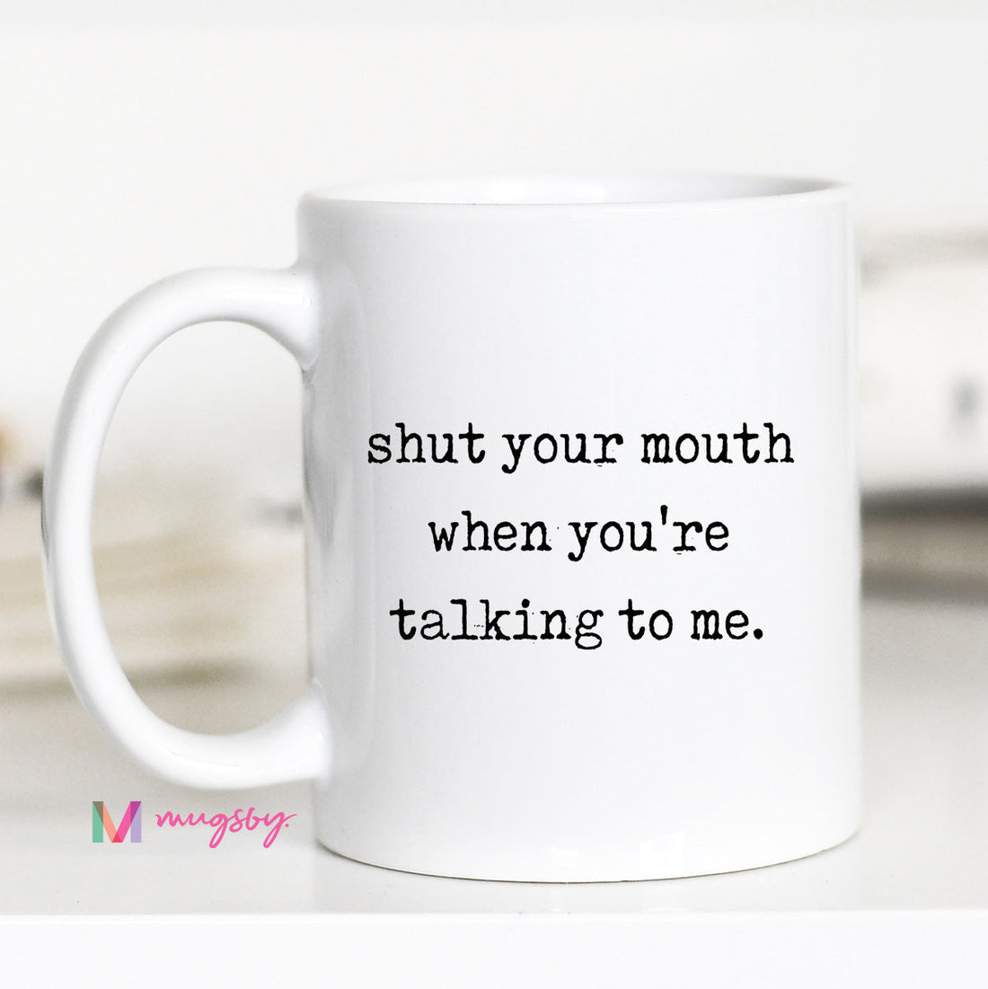 White mug with text &