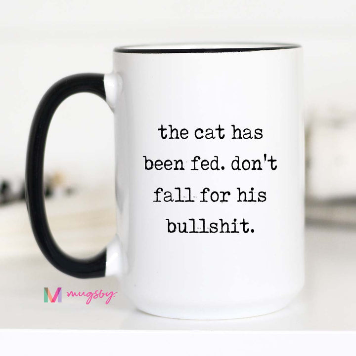 White mug with black text and handle on a white background