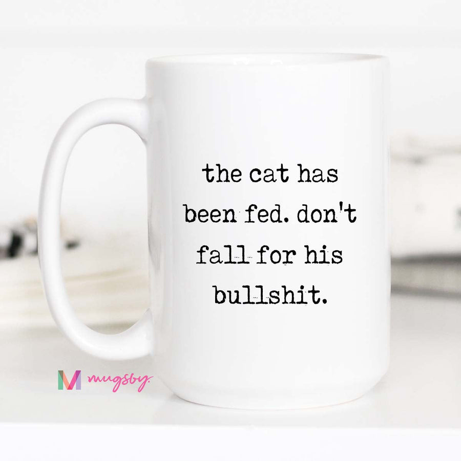 White mug with humorous text on a white background