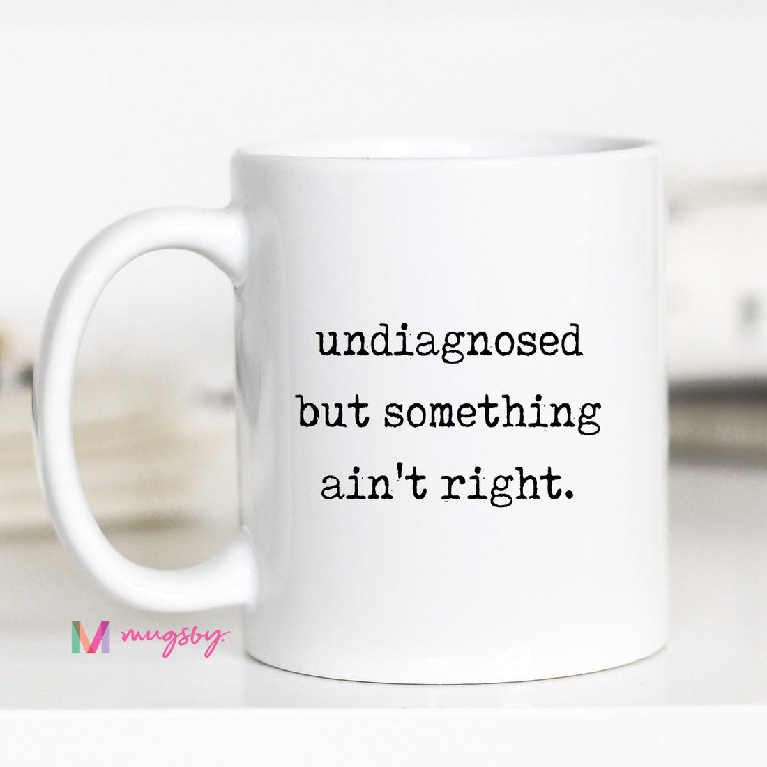 White mug with text &