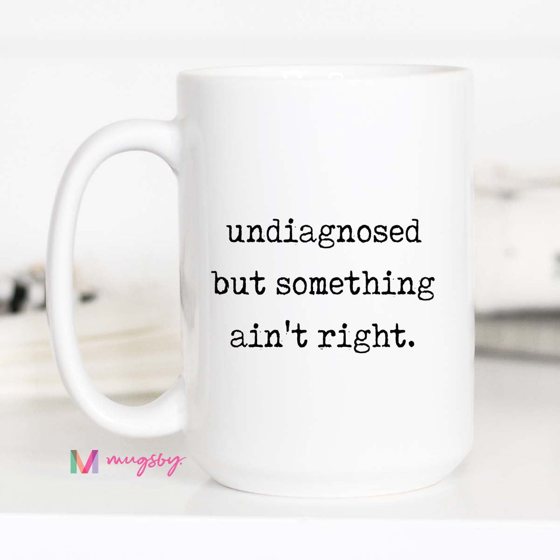 White mug with text &