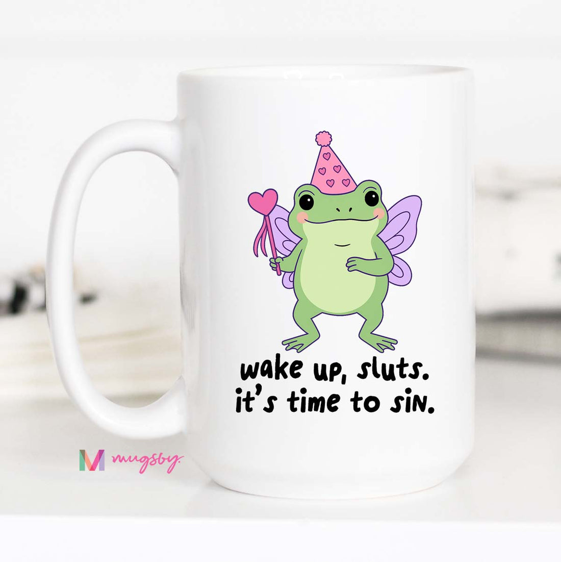 Mug with a fairy frog design and text &