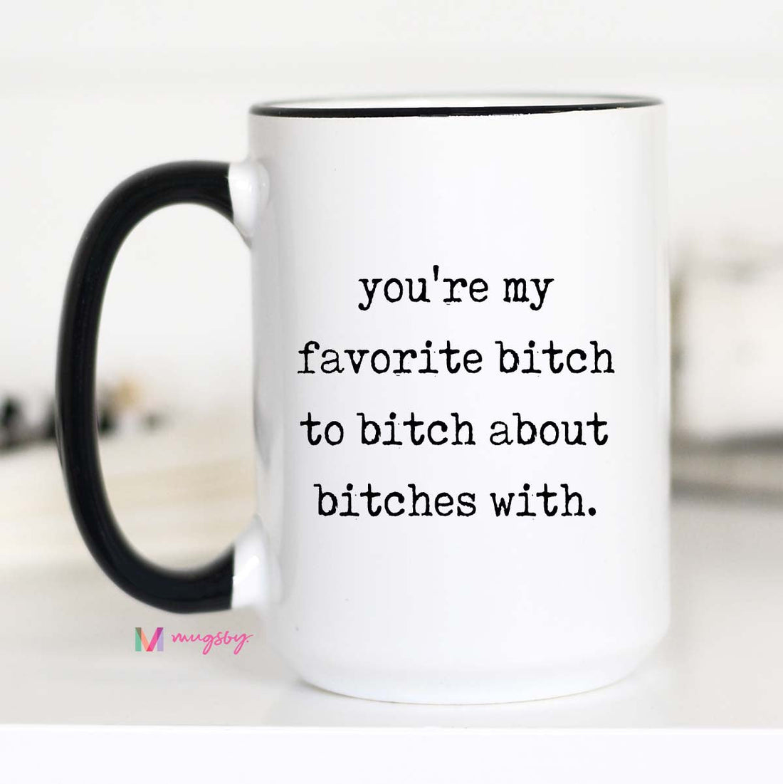 White mug with black text and handle on a white background